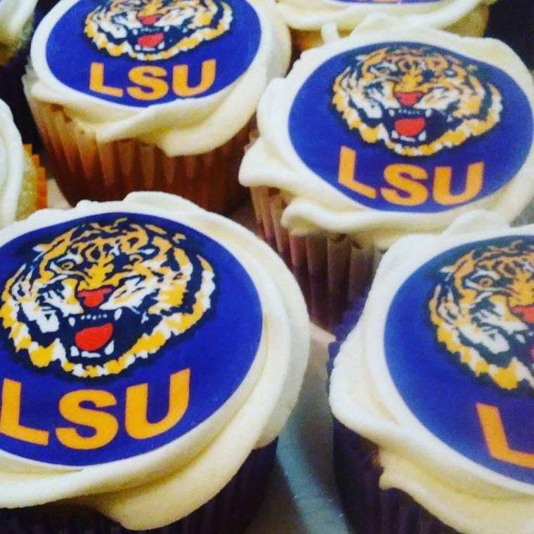 Cupcakes topped with edible LSU tiger logos