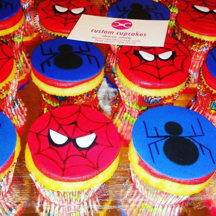 Rows of Spider-Man cupcakes with hand-cut fondant masks in red and blue