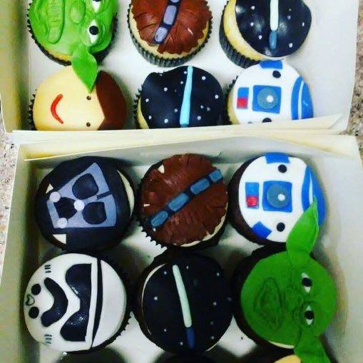 A boxed dozen of Star Wars cupcakes including Yoda, R2-D2, Darth Vader and Chewbacca